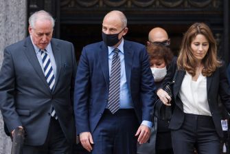 Michael Avenatti and his legal team exiting a courthouse.