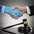 A digital hand with circuit patterns shaking hands with a human hand in a professional setting, alongside a gavel. A digital hand with circuit patterns shaking hands with a human hand in a professional setting, alongside a gavel.