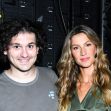 Image of Sam Bankman-Fried and Gisele Bündchen posing together at an event, with a background of equipment. Image of Sam Bankman-Fried and Gisele Bündchen posing together at an event, with a background of equipment.