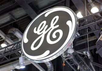 Logo of General Electric (GE) displayed prominently at an event.
