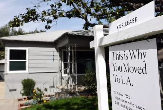 A house for lease with a sign stating "This is Why You Moved To L.A." in the foreground.