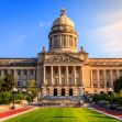 The exterior view of the Kentucky State Capitol building under a clear blue sky. The exterior view of the Kentucky State Capitol building under a clear blue sky.
