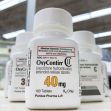 Bottle of OxyContin medication on a pharmacy shelf, labeled as containing 40 mg extended-release tablets. Bottle of OxyContin medication on a pharmacy shelf, labeled as containing 40 mg extended-release tablets.