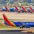 Southwest Airlines planes parked at an airport. Southwest Airlines planes parked at an airport.