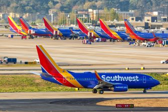 Southwest Airlines planes parked at an airport.