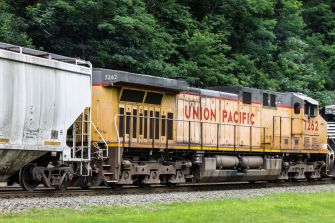 A Union Pacific freight train traveling on a railway track.