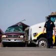 Law enforcement officers work at the scene of a deadly crash in Holtville, Calif., on Tuesday, March 2, 2021. Authorities say a semi-truck crashed into an SUV carrying 25 people on a Southern California highway, killing at least 13 people. (AP Photo/Gregory Bull)