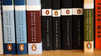 A display of Penguin Classics books on a shelf.
