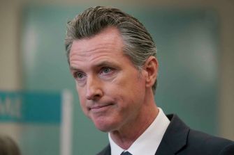 Governor Gavin Newsom during a press event, addressing issues related to homelessness in California.