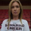 Head coach Monica Aldama of Navarro College cheerleading team in a gym setting. Head coach Monica Aldama of Navarro College cheerleading team in a gym setting.