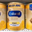 Cans of Enfamil infant formula on a store shelf. Cans of Enfamil infant formula on a store shelf.