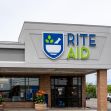 Exterior view of a Rite Aid pharmacy with the store's logo prominently displayed. Exterior view of a Rite Aid pharmacy with the store's logo prominently displayed.