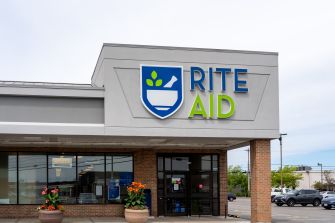 Exterior view of a Rite Aid pharmacy with the store's logo prominently displayed.