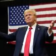 Donald Trump speaks at a campaign rally with an American flag in the background. Donald Trump speaks at a campaign rally with an American flag in the background.
