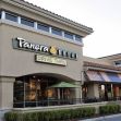 Exterior view of a Panera Bread restaurant featuring the sign and a drive-thru lane. Exterior view of a Panera Bread restaurant featuring the sign and a drive-thru lane.