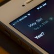 Image of a smartphone screen displaying the Siri interface with the prompt "Hey Siri" visible. Image of a smartphone screen displaying the Siri interface with the prompt "Hey Siri" visible.