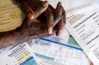 Hands clasped over medical bills with a "PAST DUE" notice prominently displayed.