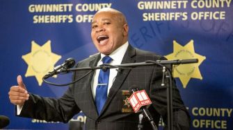 Newly sworn-in Gwinnett County Sheriff Keybo Taylor speaking at a press conference, emphasizing the decision to end the county's involvement in the 287(g) program.
