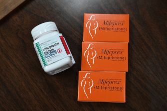 Medication bottles for mifepristone and misoprostol, commonly used in abortion procedures.