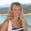 Sherri Papini smiling near a scenic lake with mountains in the background. Sherri Papini smiling near a scenic lake with mountains in the background.