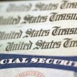 Stack of U.S. Treasury checks with a Social Security card on top. Stack of U.S. Treasury checks with a Social Security card on top.