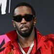 Sean “Diddy” Combs at an event, wearing sunglasses and a red jacket. Sean “Diddy” Combs at an event, wearing sunglasses and a red jacket.