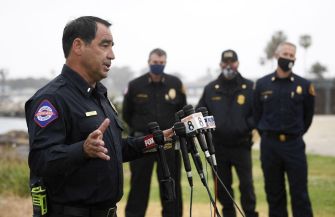 A police official addresses reporters during a press conference regarding the capsized boat incident near San Diego.