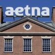 Aetna building with the company's logo prominently displayed on top. Aetna building with the company's logo prominently displayed on top.