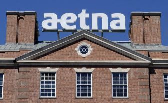Aetna building with the company's logo prominently displayed on top.