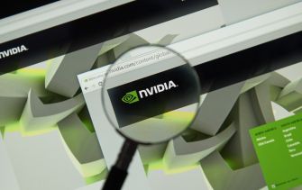 Image of NVIDIA's logo displayed on a computer screen with a magnifying glass highlighting the brand name.