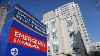 Sign for Emory University Hospital Midtown, indicating the emergency department.