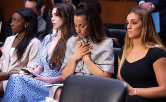 Survivors of Larry Nassar attending a Senate hearing, emphasizing the emotional impact of the case.