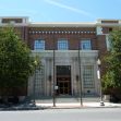 Historic building of The Bakersfield Californian newspaper, surrounded by trees under a clear sky. Historic building of The Bakersfield Californian newspaper, surrounded by trees under a clear sky.