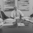 Group of attorneys discussing a class-action lawsuit related to insurance coverage for pain management devices. Group of attorneys discussing a class-action lawsuit related to insurance coverage for pain management devices.