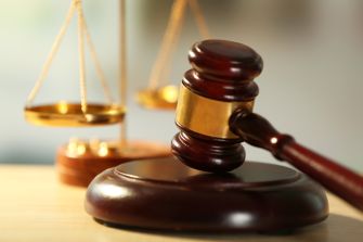 A gavel and scales of justice symbolizing the legal system.