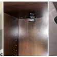 Images of a bathroom cabinet and hidden camera setup allegedly used for secretly recording patients and staff at a chiropractor's office. Images of a bathroom cabinet and hidden camera setup allegedly used for secretly recording patients and staff at a chiropractor's office.