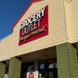 Exterior view of a Grocery Outlet store with signage indicating it as a "bargain market." Exterior view of a Grocery Outlet store with signage indicating it as a "bargain market."