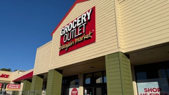 Exterior view of a Grocery Outlet store with signage indicating it as a "bargain market."
