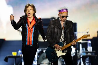 Mick Jagger and Keith Richards performing on stage.