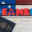 Colorful letters spelling "DREAMERS" next to a U.S. passport and a certificate on a background resembling the American flag. Colorful letters spelling "DREAMERS" next to a U.S. passport and a certificate on a background resembling the American flag.
