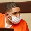 Suspect in custody for freeway shootings, wearing an orange jumpsuit and mask in court. Suspect in custody for freeway shootings, wearing an orange jumpsuit and mask in court.