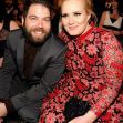 Adele and Simon Konecki sitting together at an event, both smiling. Adele and Simon Konecki sitting together at an event, both smiling.