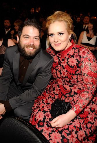 Adele and Simon Konecki sitting together at an event, both smiling.