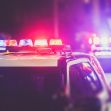 Police vehicles with flashing lights responding to an incident. Police vehicles with flashing lights responding to an incident.