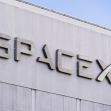 Signage of the SpaceX building with the company logo prominently displayed. Signage of the SpaceX building with the company logo prominently displayed.