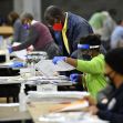 Workers sorting and reviewing ballots during the 2020 presidential election in Fulton County, Georgia. Workers sorting and reviewing ballots during the 2020 presidential election in Fulton County, Georgia.