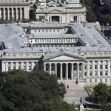 Aerial view of the U.S. Department of the Treasury building, surrounded by trees and urban landscape. Aerial view of the U.S. Department of the Treasury building, surrounded by trees and urban landscape.