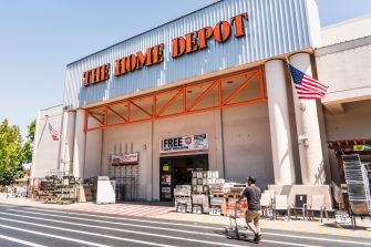 Home Depot store exterior with signs and products displayed outside.
