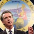 California Governor Gavin Newsom speaking at a podium with the state seal in the background. California Governor Gavin Newsom speaking at a podium with the state seal in the background.
