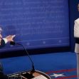Image of Donald Trump and Hillary Clinton during a presidential debate, with Trump speaking passionately and Clinton listening. Image of Donald Trump and Hillary Clinton during a presidential debate, with Trump speaking passionately and Clinton listening.